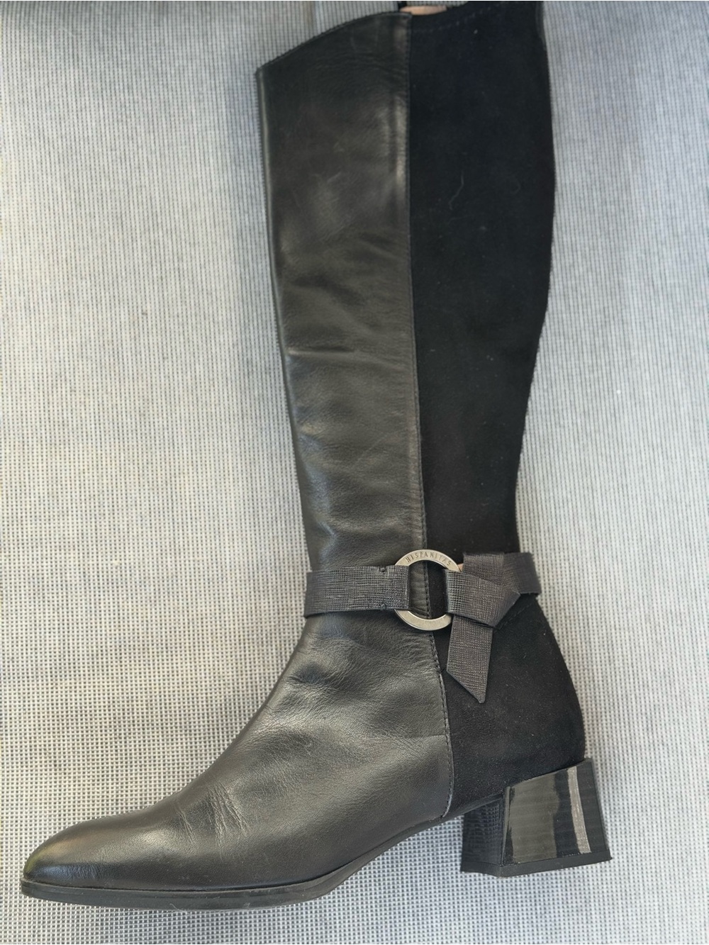 Sleek Black Leather Knee-High Heeled Boots. Made in Spain.